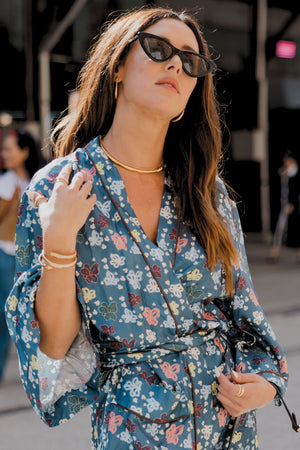 Gold plated jewellery paired with petrol blue silk robe